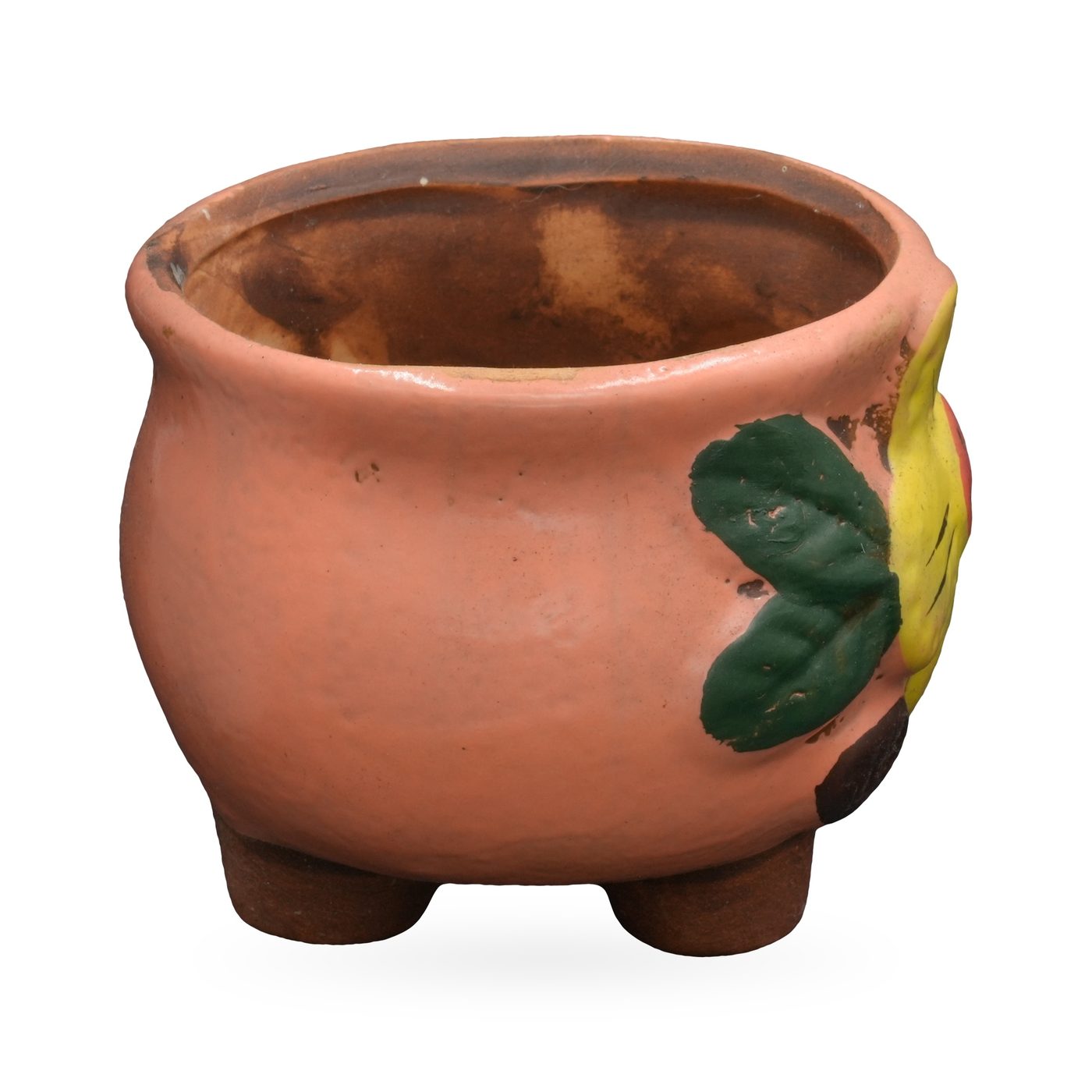Salmon-pink painted terracotta footed pot with a raised yellow flower and green leaves – view 2