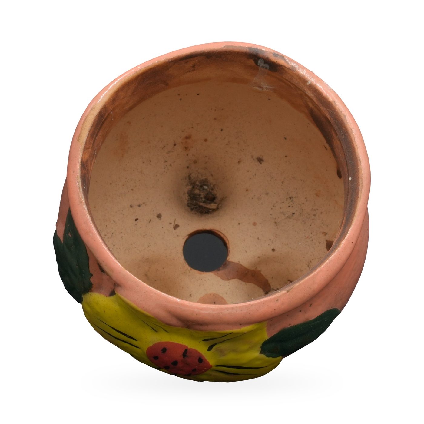 Salmon-pink painted terracotta footed pot with a raised yellow flower and green leaves – view 3