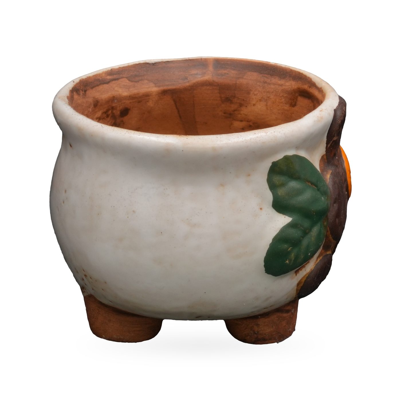 Cream painted terracotta footed pot with a raised brown flower, orange centre and green leaves – view 2