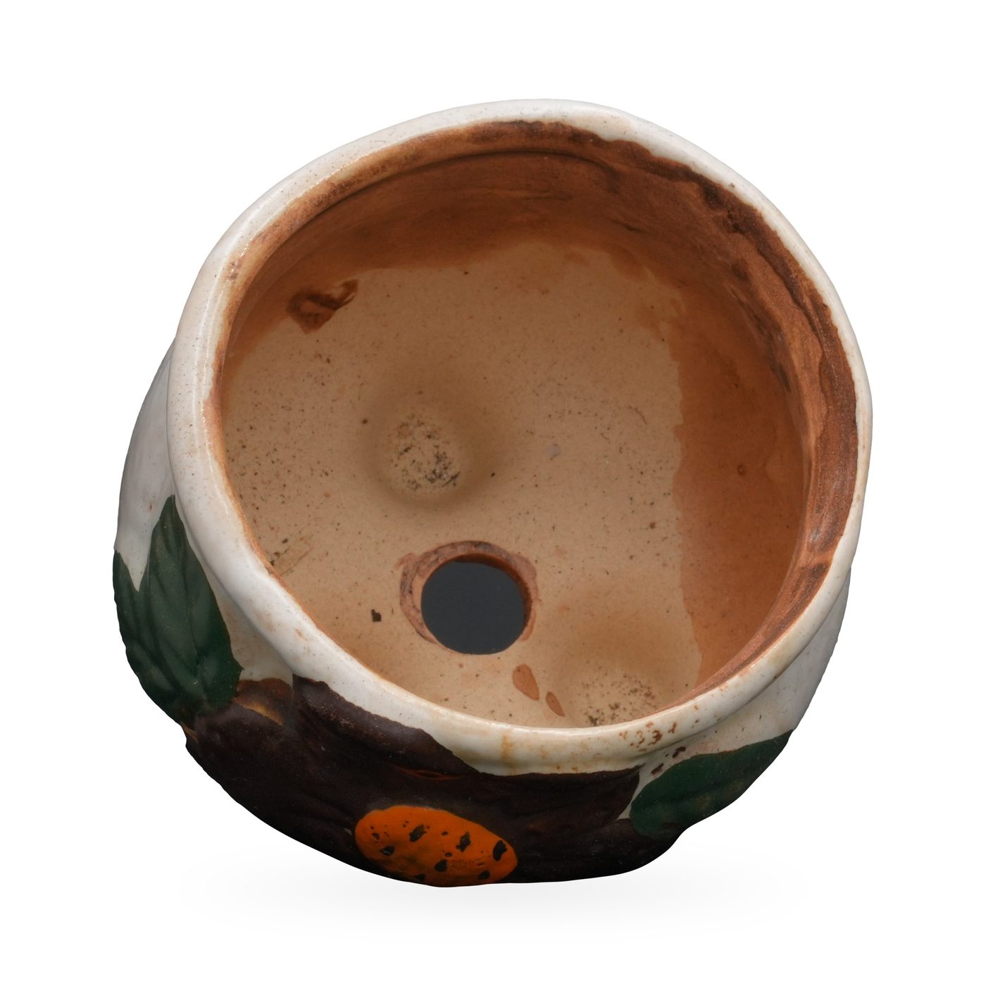 Cream painted terracotta footed pot with a raised brown flower, orange centre and green leaves – view 3