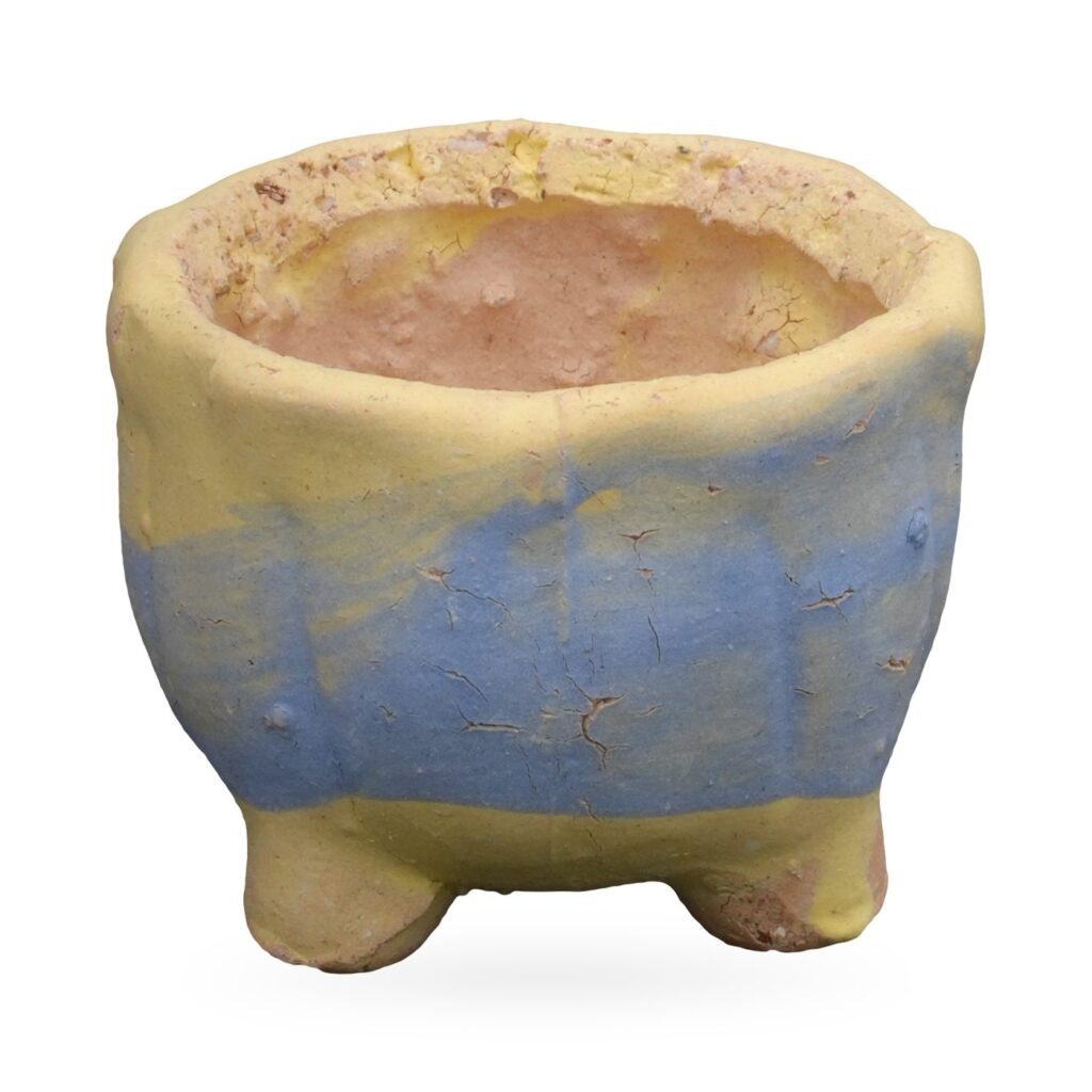 Mini pale-lemon matte pot with periwinkle-blue band, natural clay rim and stubby feet