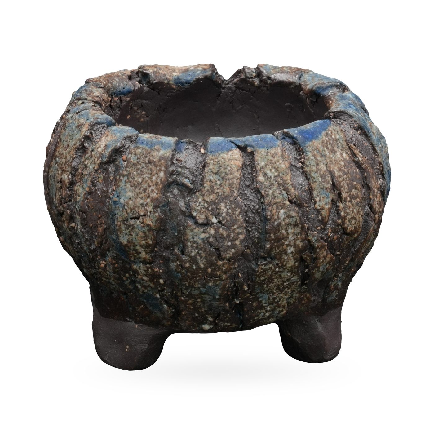 Low round footed pot with charcoal bark-like ridges and deep blue glaze touches around the rim