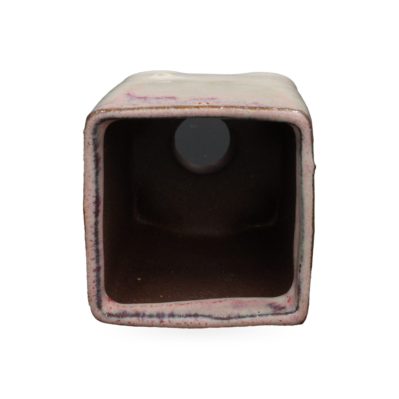 Cream glazed square footed pot with pink-purple blush at the rim and dark brown clay feet – view 3
