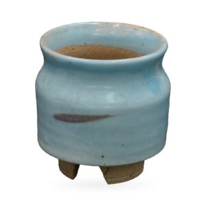 Pale sky-blue glazed footed pot with a charcoal brushstroke accent and rough-cut clay feet