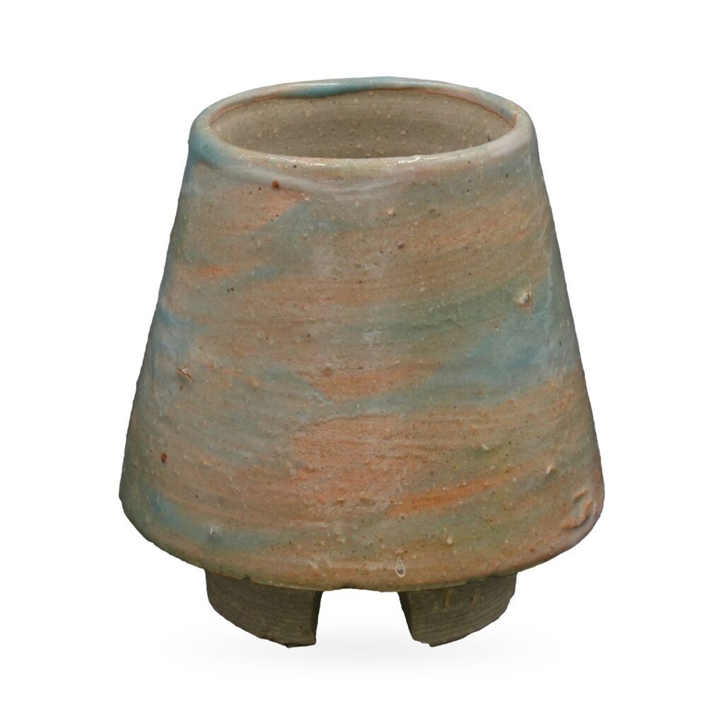 Tapered cone-shaped pot in rustic blush-beige and pale aqua glaze on small grey-brown feet