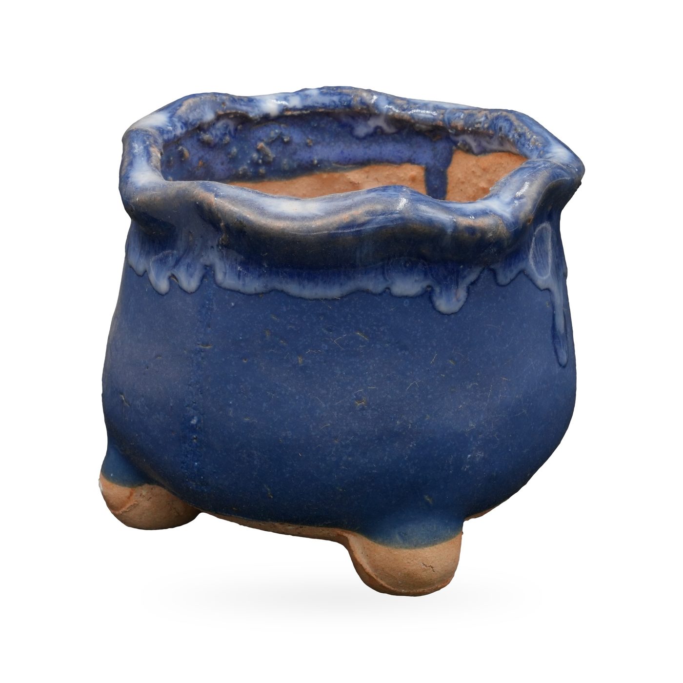 Cobalt blue footed pot with a wavy rim and glossy blue and white glaze drips from the rim – view 2