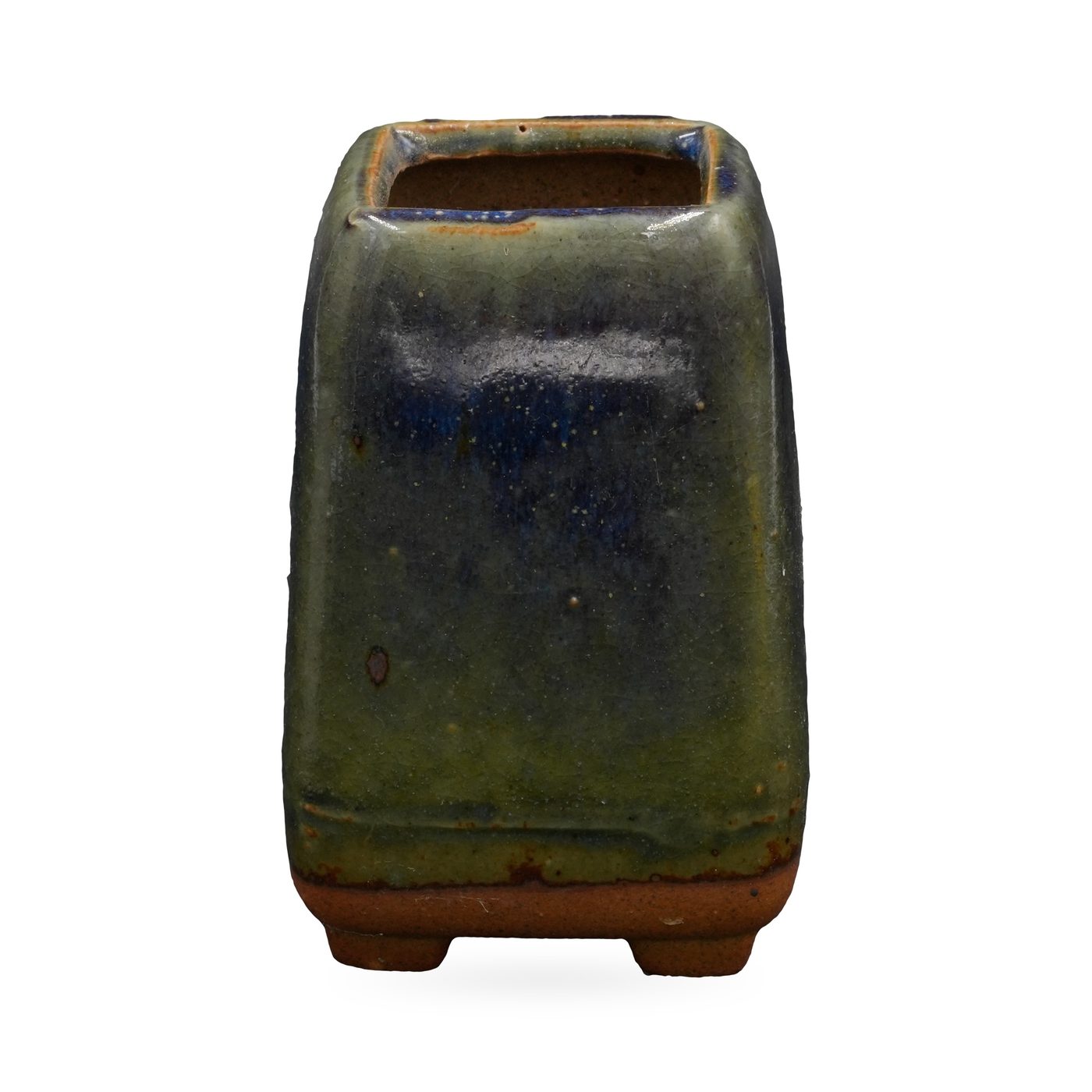 Tall square succulent pot in glossy olive-green and cobalt-blue glaze, standing on small feet