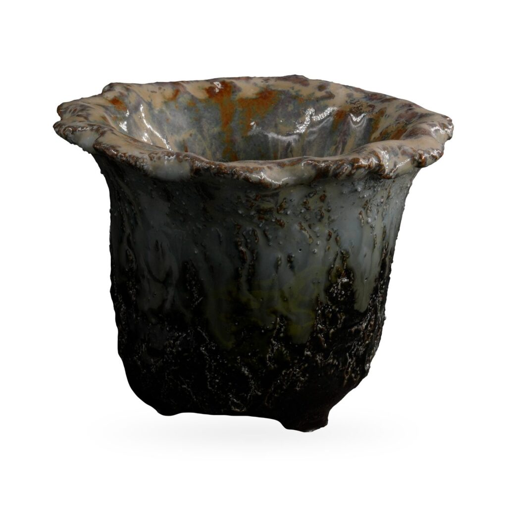 Ruffled-rim succulent pot in glossy lava-textured glaze, black at the base fading to blue-grey and rust