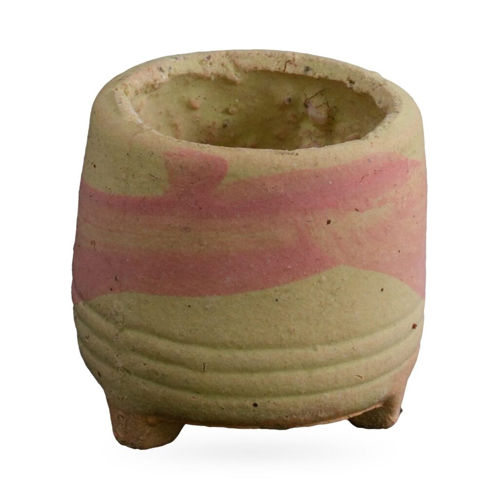 Mini footed pot with a sandy texture and pink and pale yellow marbled swirl