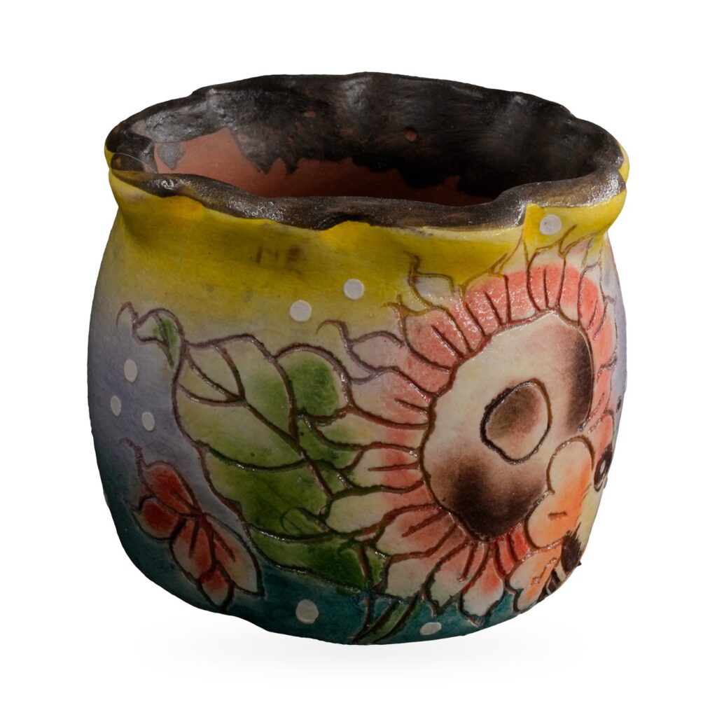 Lilac-blue painted pot with peach sunflowers, a bee and a yellow band under a wavy dark rim