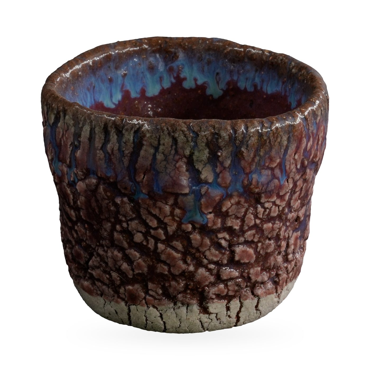 Round rustic pot with raised purple-pink crackle glaze and blue glaze drips at the rim