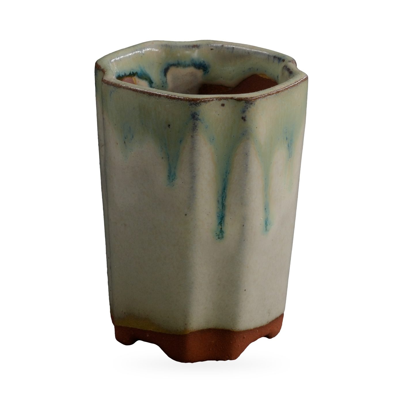 Tall faceted cream pot with sea-green drip glaze from the rim and red-brown clay feet