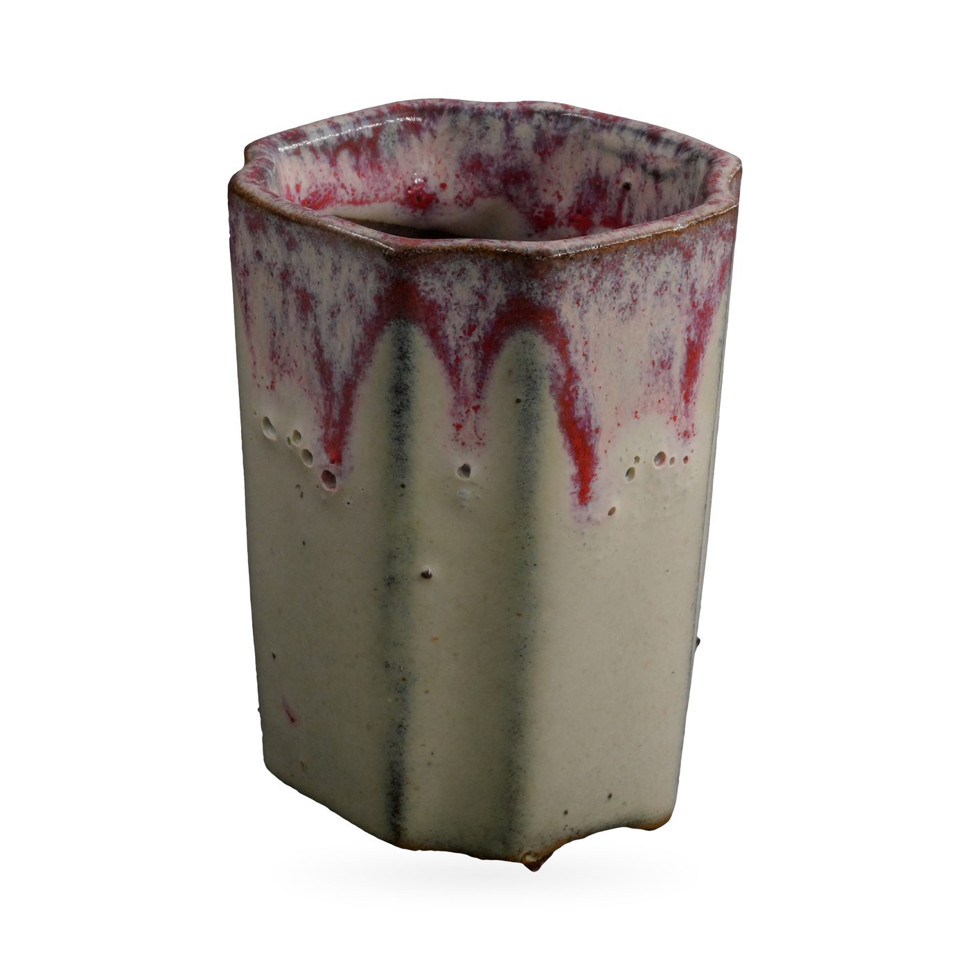 Slim faceted cream pot with speckled red-purple drip glaze from the rim