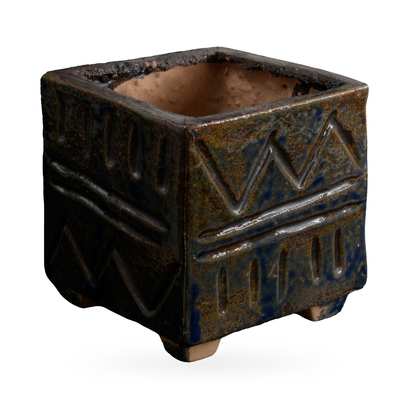 Square dark blue-black glazed pot with a textured zigzag and band pattern on small feet – view 2