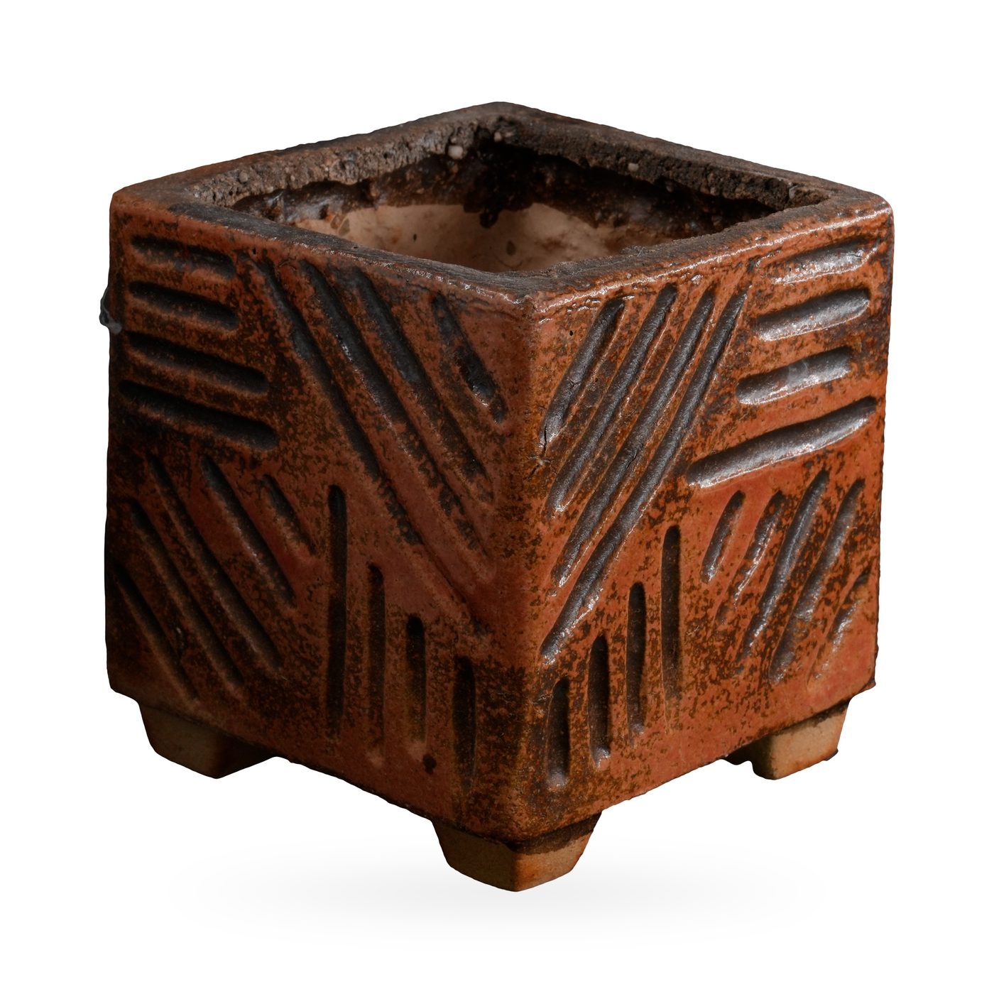 Speckled rust-orange square pot with carved line grooves, standing on small feet – view 2