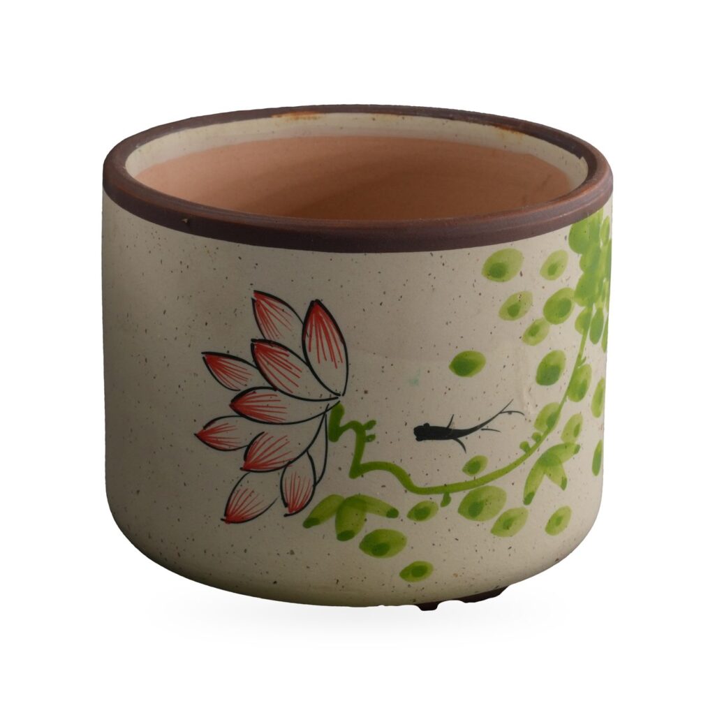 Speckled cream cylinder pot painted with a pink lotus and lime green vine, dark brown rim