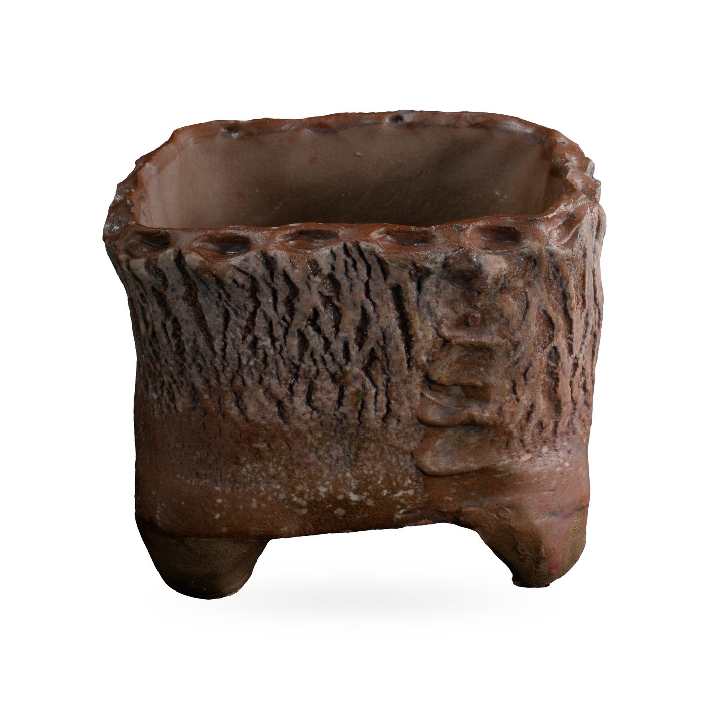 Rust-brown square footed pot with deep bark-like texture, ladder-like ridged corner and scalloped rim