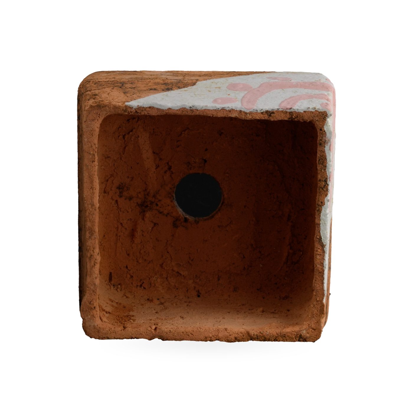 Low orange square pot with dark mottling and a white triangular corner panel with pink arc-and-dot motif – view 3