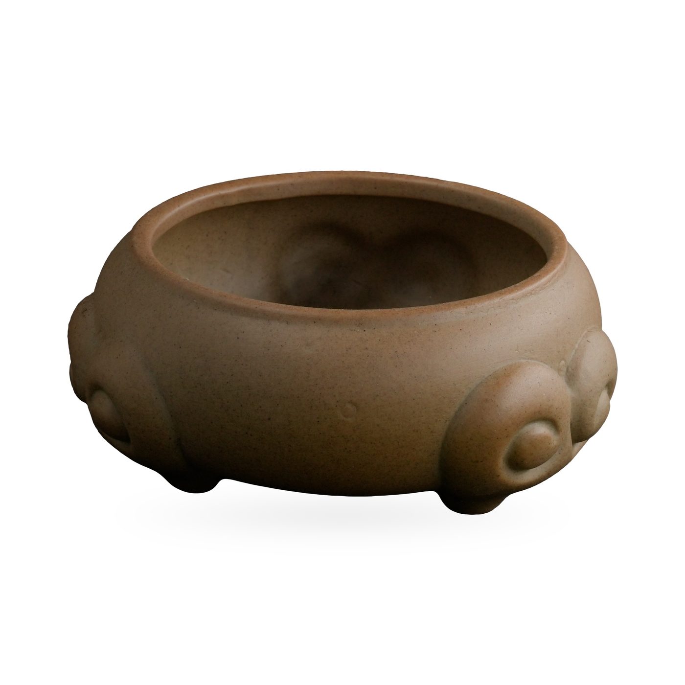 Low khaki tan succulent bowl with raised scroll-like swirl motifs that form its small feet – view 2
