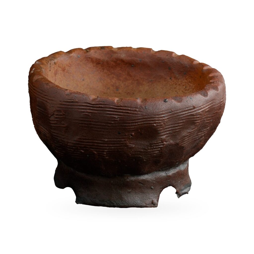 Rustic red-brown glazed bowl pot with crimped rim, ridged sides and notched foot