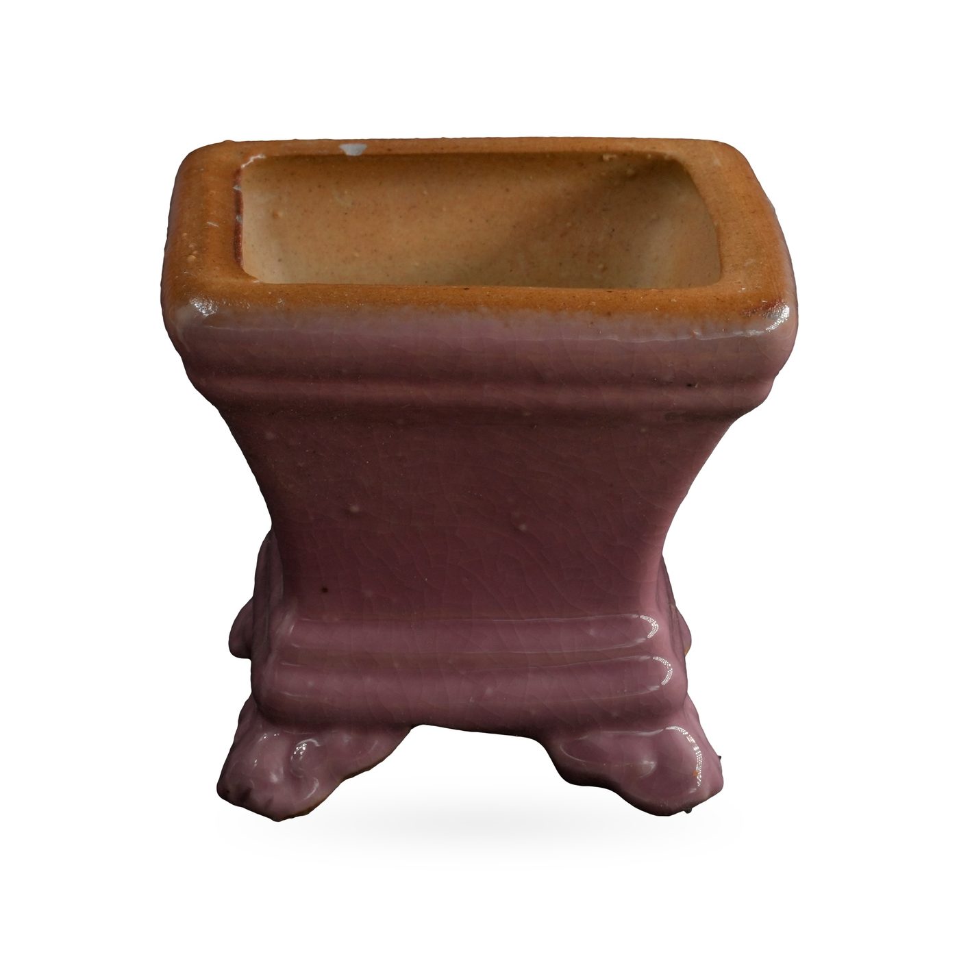 Small dusty pink square glazed pot with a tan rim, standing on cloud-shaped feet