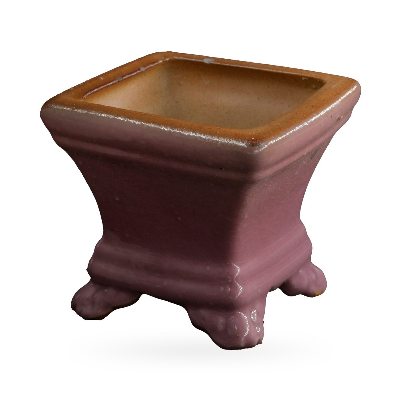 Small dusty pink square glazed pot with a tan rim, standing on cloud-shaped feet – view 2