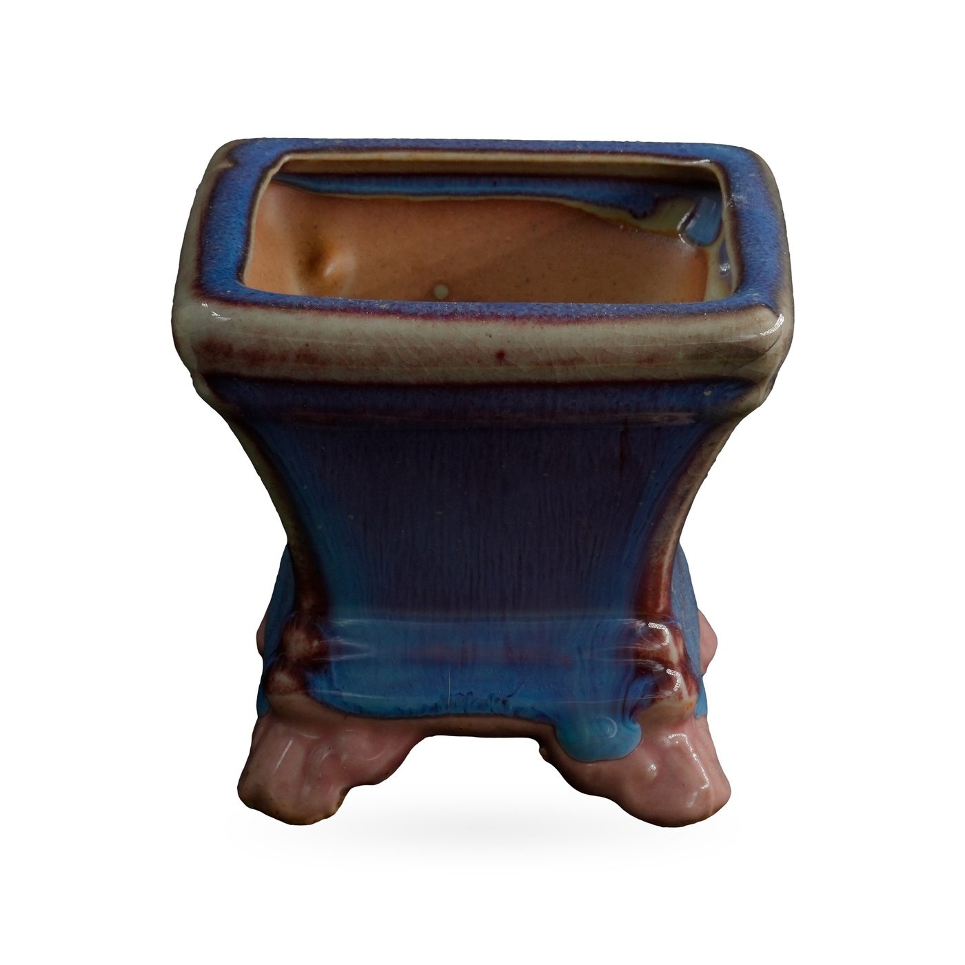 Square pot in glossy blue glaze streaked with purple, with a beige-edged rim, on glossy pink cloud-shaped feet
