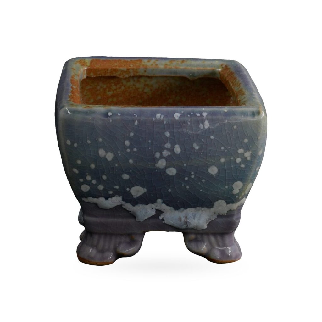 Square blue-grey speckled glazed succulent pot with lilac-purple base band on scroll feet
