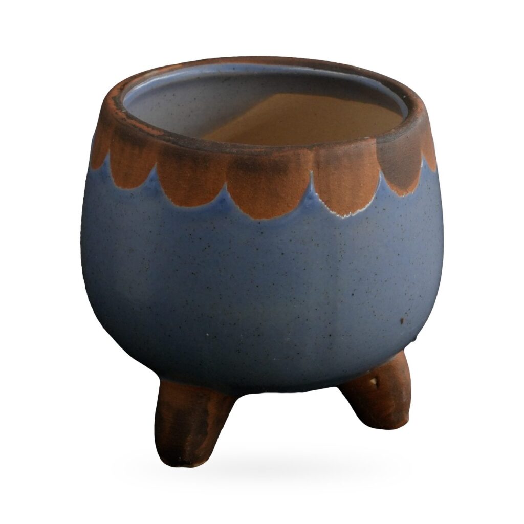Small periwinkle-blue footed succulent pot with a rust-brown scalloped rim band