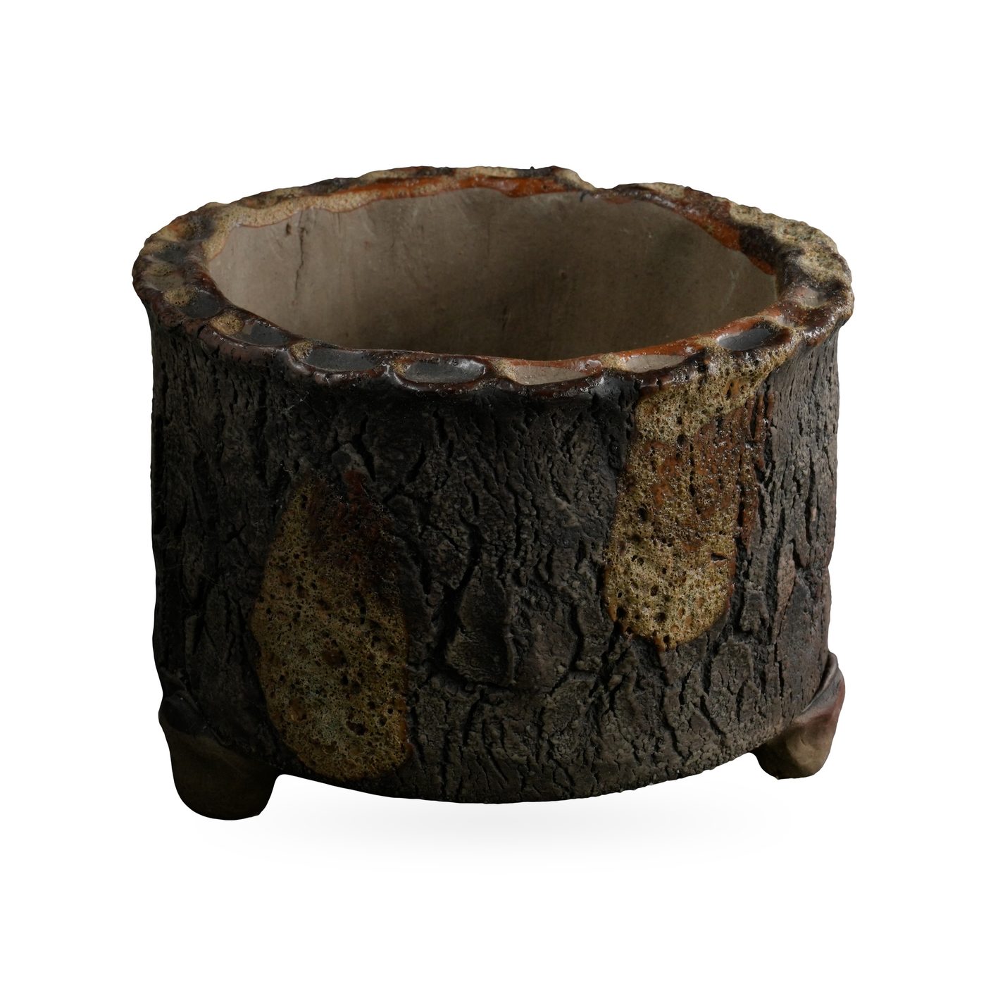 Round dark brown bark-texture footed pot with olive glaze drips and a scalloped rim