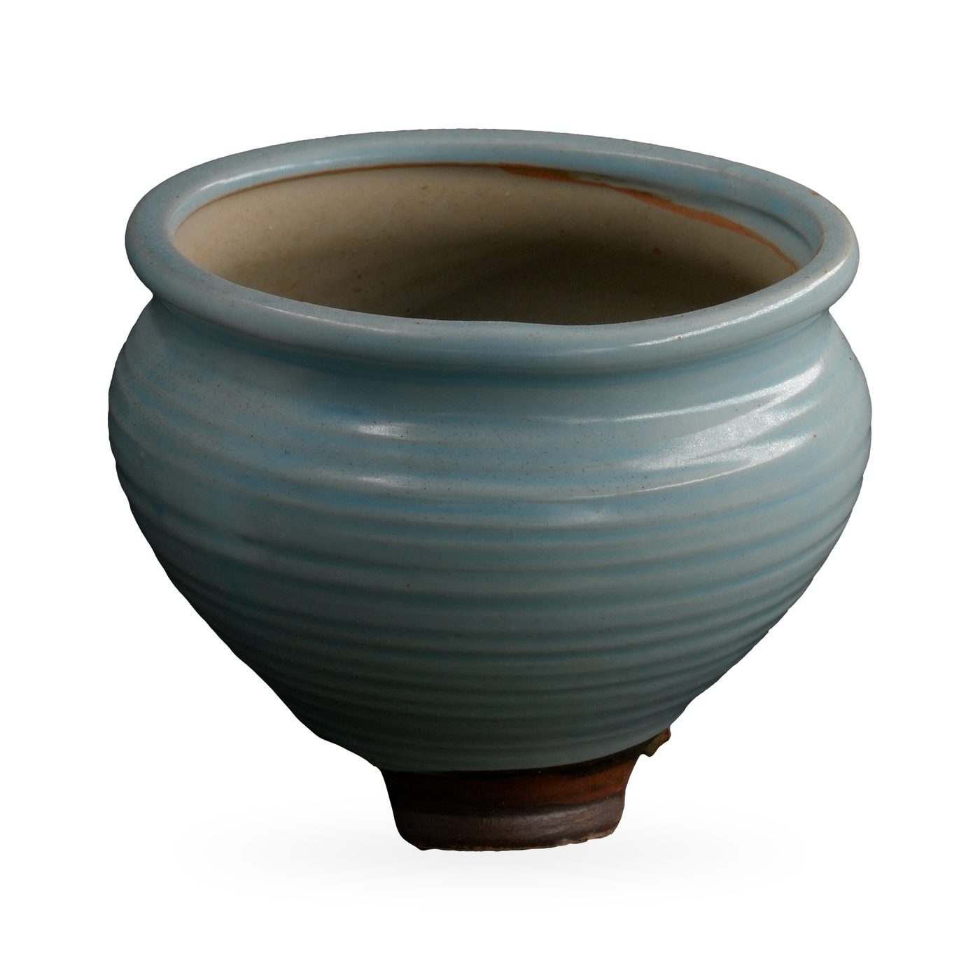 Pale blue ribbed glazed pot with rolled rim on small dark brown feet