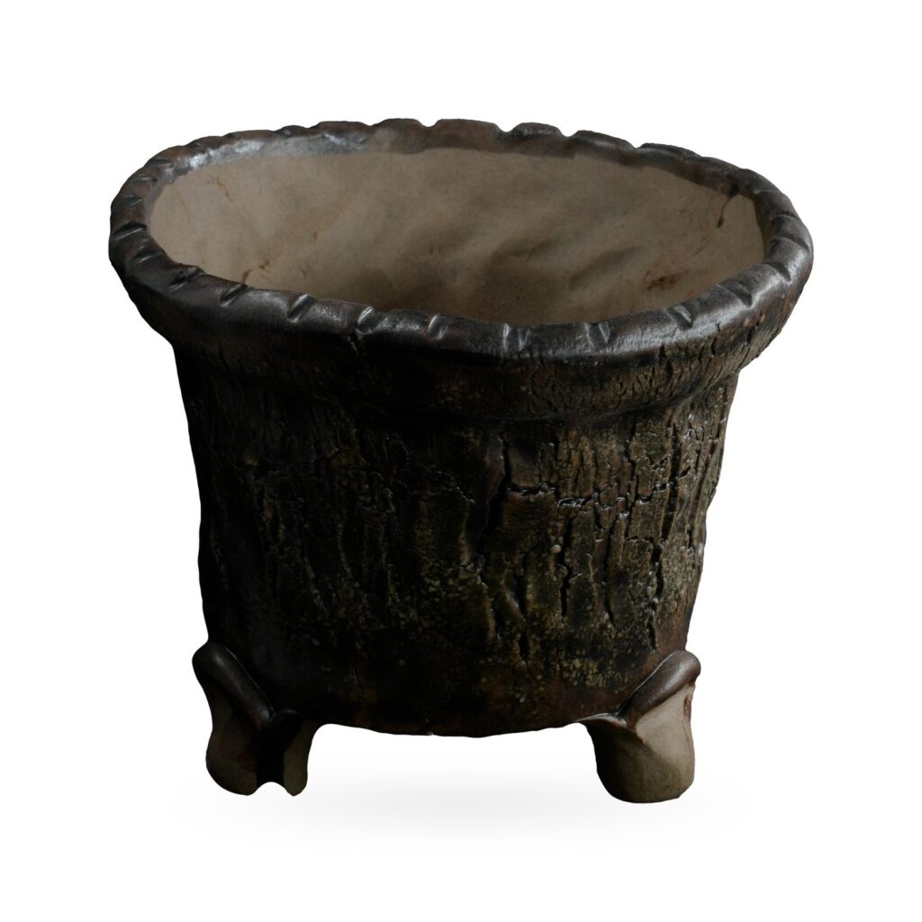 Tapered dark brown bark-texture pot with scalloped rim on small scrolled feet
