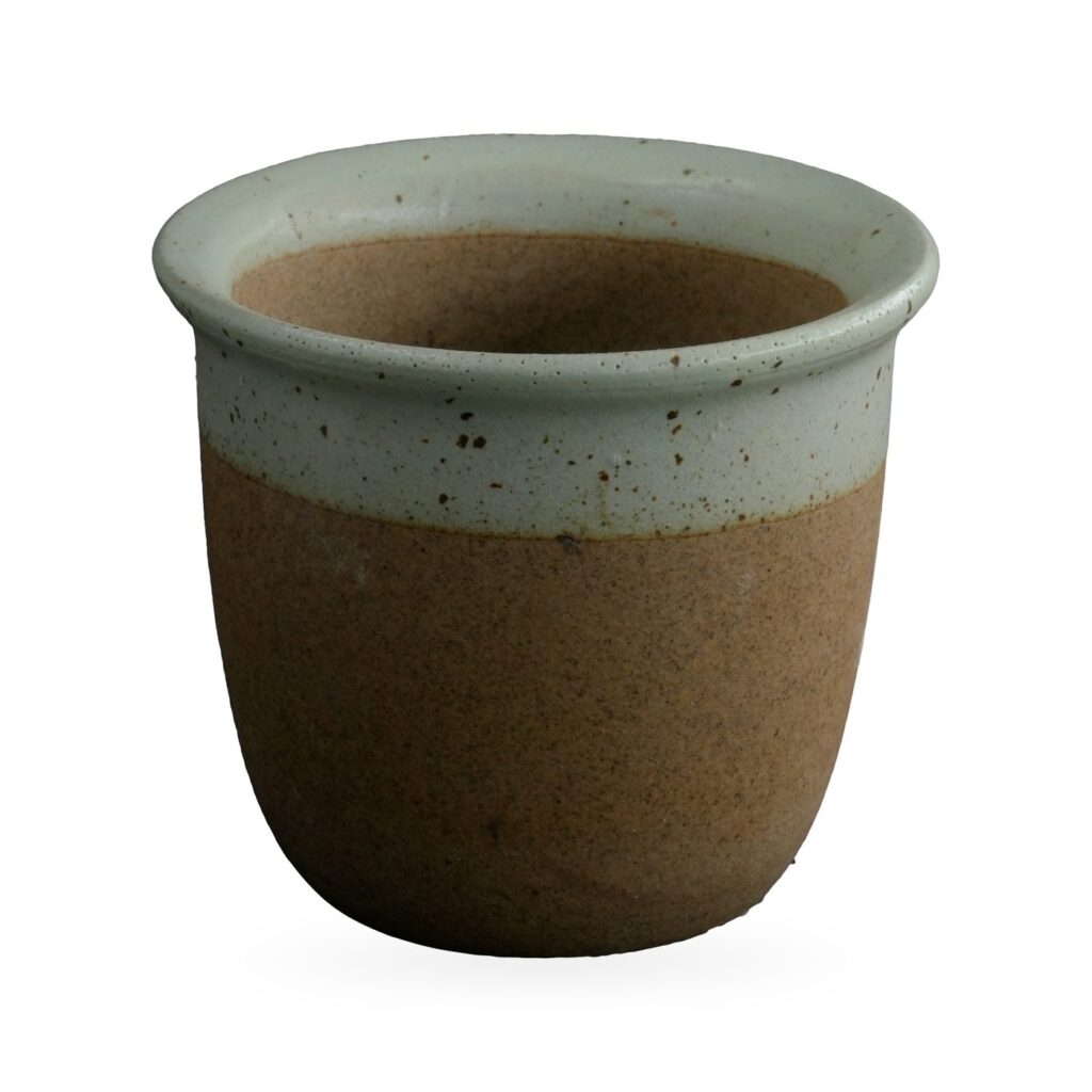 Cup-shaped pot with speckled sage-green glaze band over raw brown clay