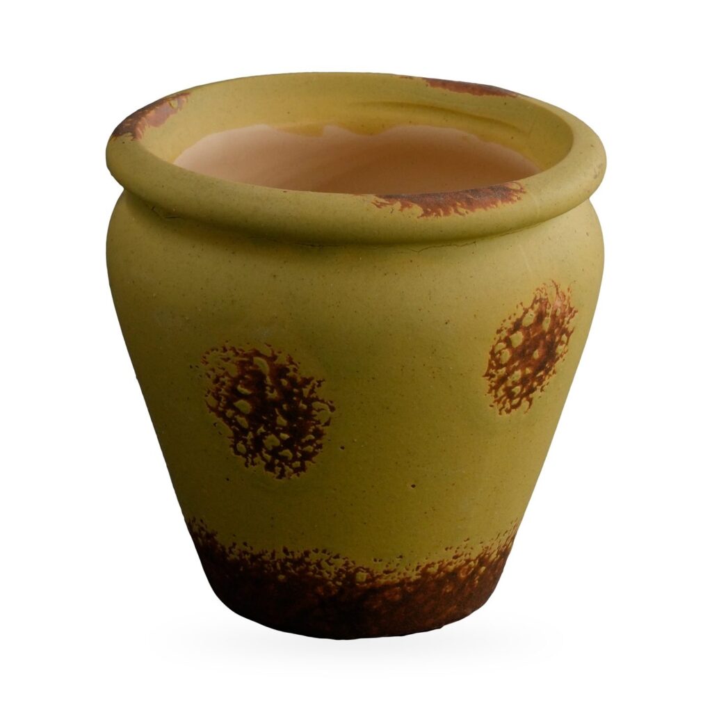 Small olive yellow vase-shaped pot with rust-brown speckled patches and distressed base