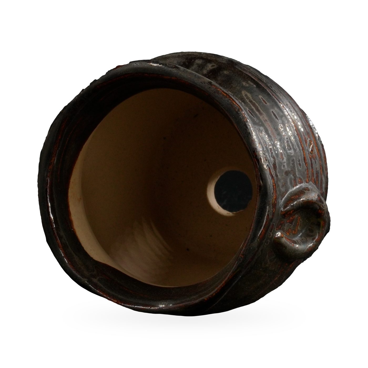 Small black-brown glazed rustic pot with textured body, wavy rim and two small loop ears – view 3