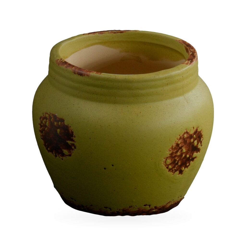 Lime-green matte rustic pot with ribbed collar and rust-brown distressed patches