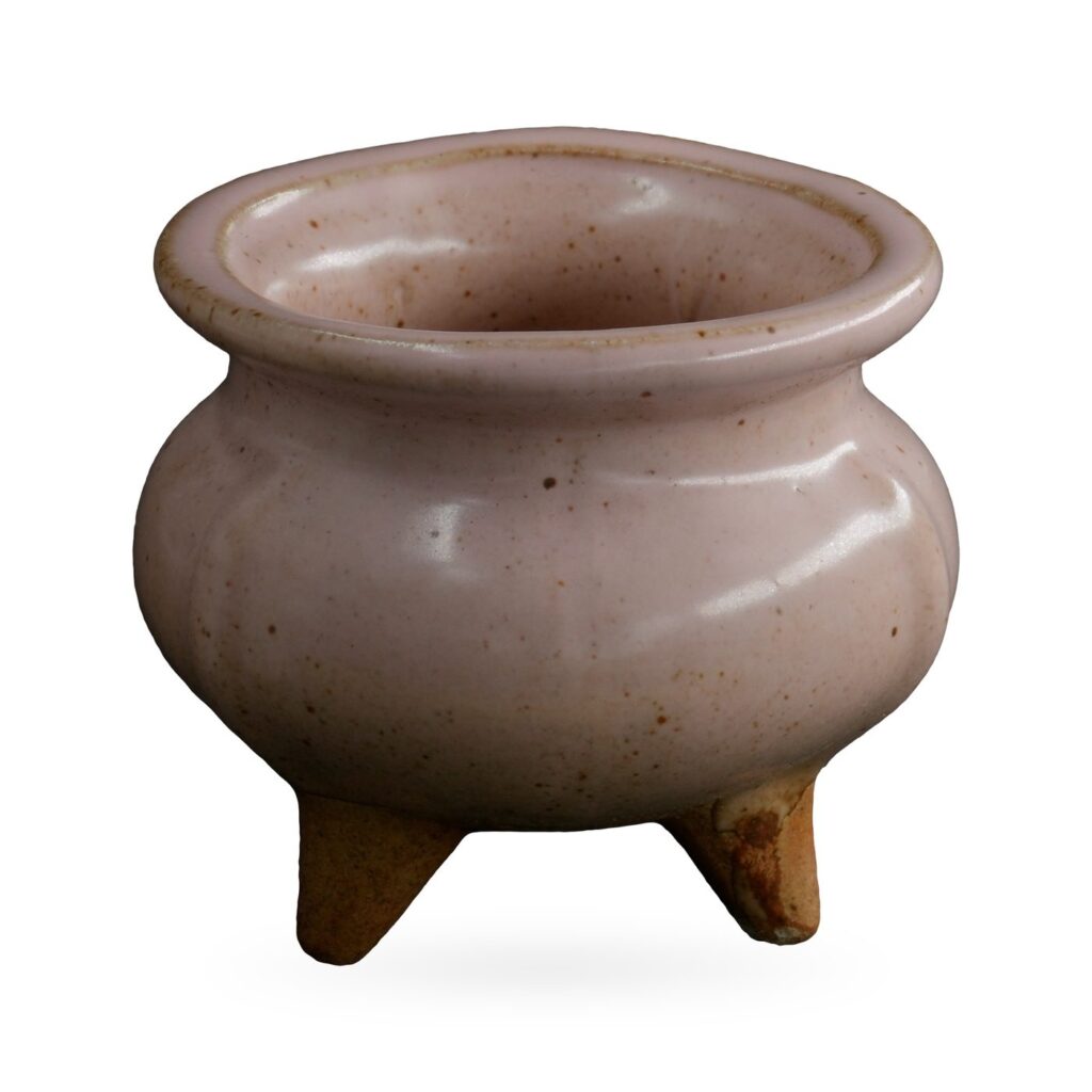 Dusty pink speckled glazed cauldron-style pot on small unglazed clay feet