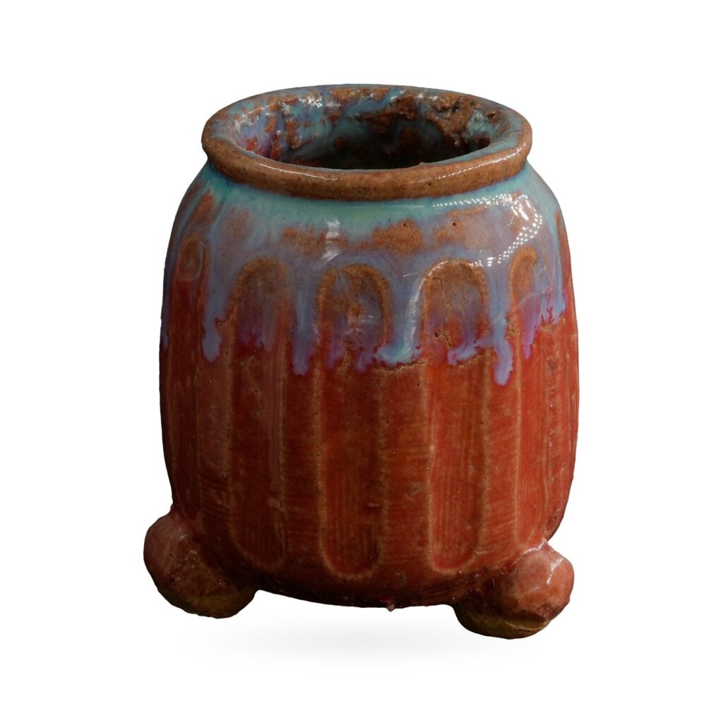 Ribbed copper-red pot with turquoise and lavender drip glaze on small rounded feet, 6.5×7.5cm