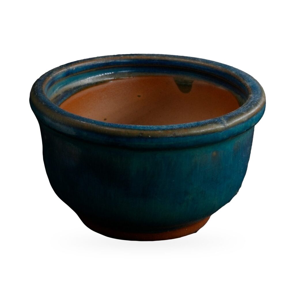 Small teal glazed bowl pot with rolled rim and terracotta-coloured interior