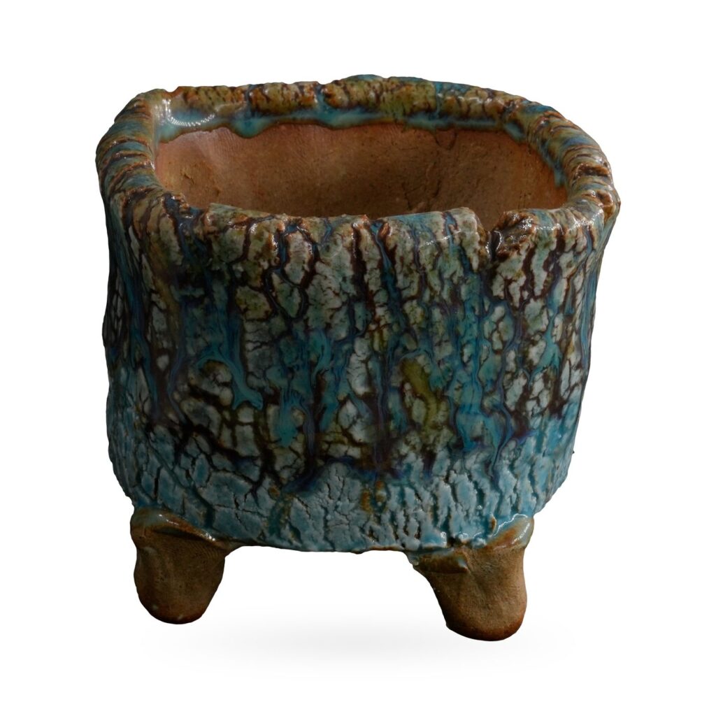 Rustic footed pot with turquoise crackle glaze and dark brown bark-like veining