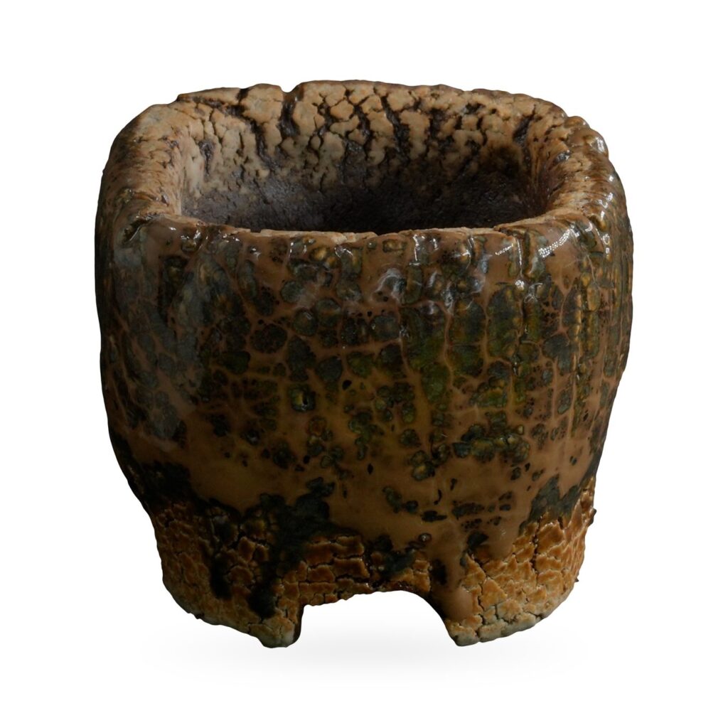 Mini rustic pot with glossy caramel drip glaze, olive mottling and small notched feet