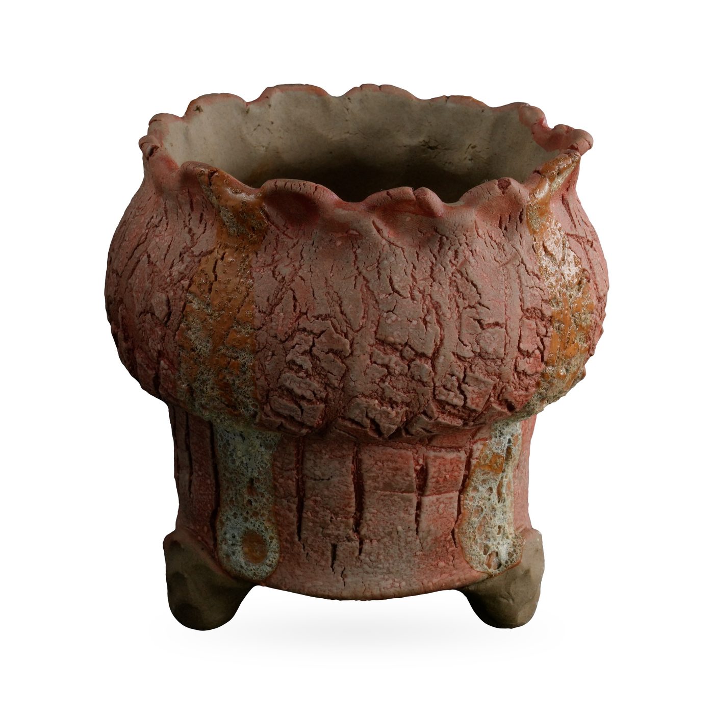 Terracotta-pink crackle-glaze footed pot with ochre streaks and a frilled scalloped rim