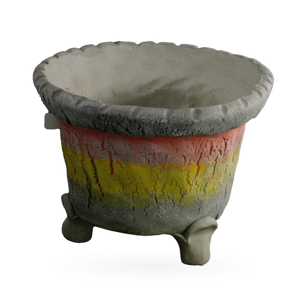 Rustic footed pot with charcoal crackle texture, red and yellow bands and scalloped rim