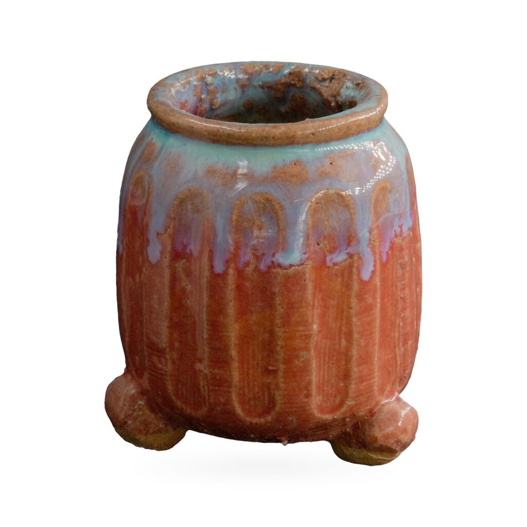 Ribbed copper-red pot with turquoise and lavender drip glaze on small rounded feet, 6.5×7.5cm