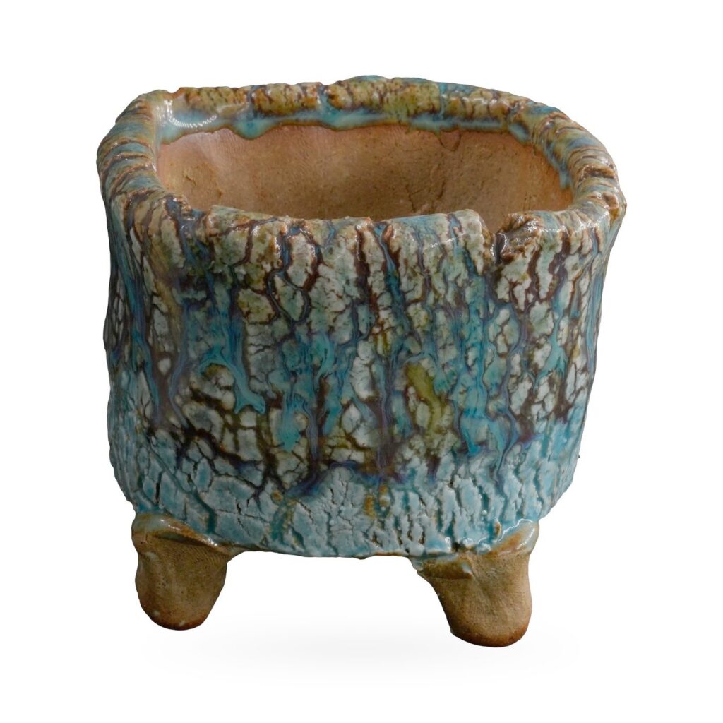 Rustic footed pot with turquoise crackle glaze and dark brown bark-like veining