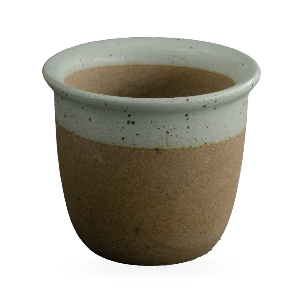 Cup-shaped pot with speckled sage-green glaze band over raw brown clay