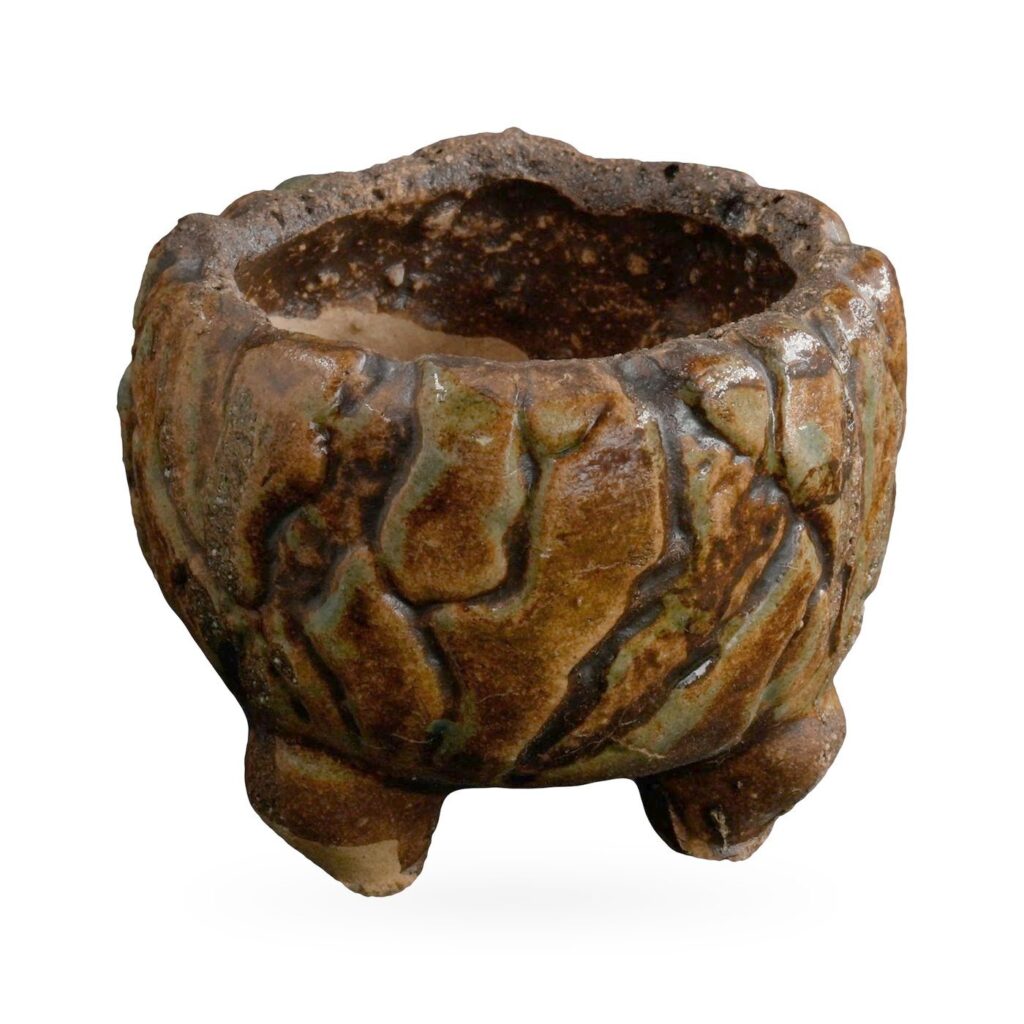 Footed pot with bark-like texture in glossy dark brown and amber glaze and a rough rim