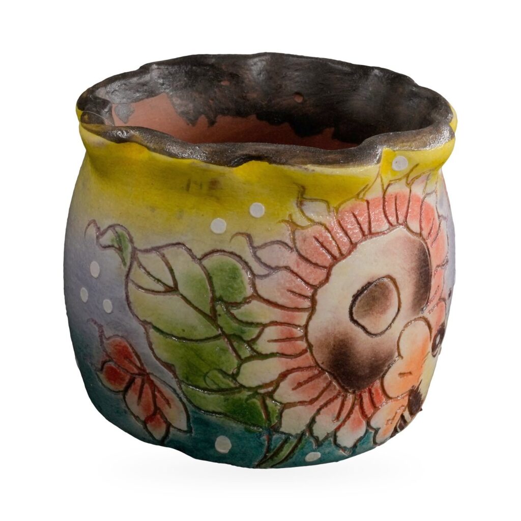 Lilac-blue painted pot with peach sunflowers, a bee and a yellow band under a wavy dark rim