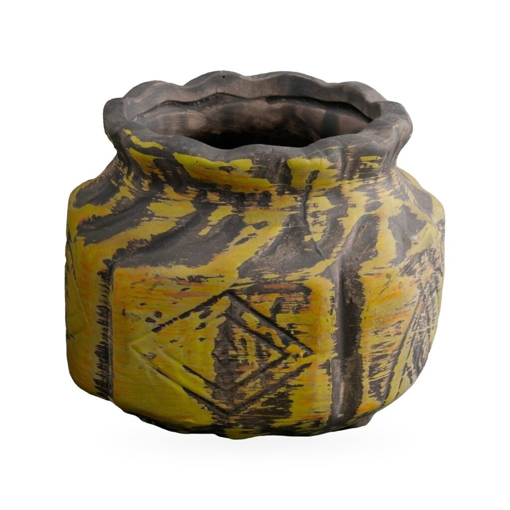 Squat mustard-yellow carved pot with black markings, geometric motifs and a wavy dark rim