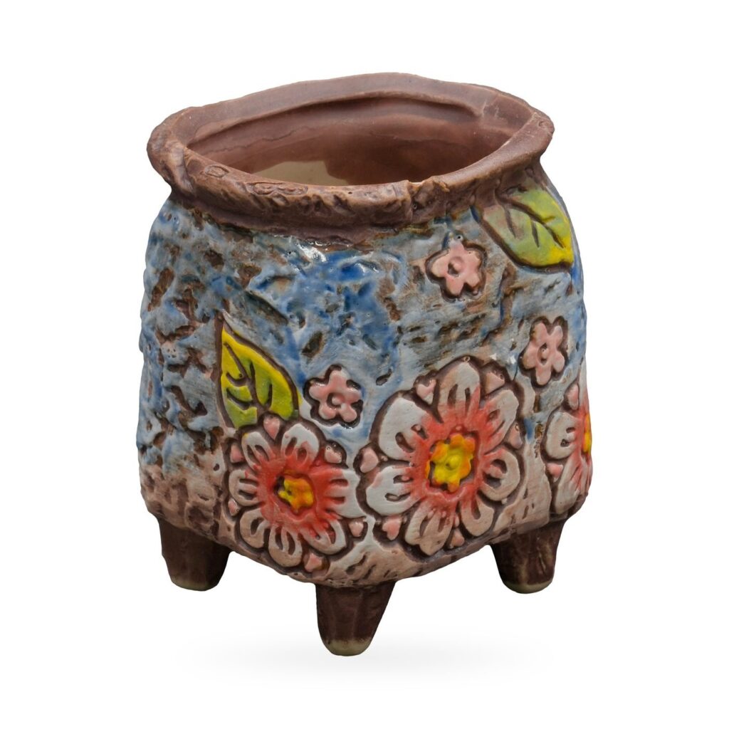 Blue textured footed succulent pot with raised coral, pink and white flowers and green leaves – view 2